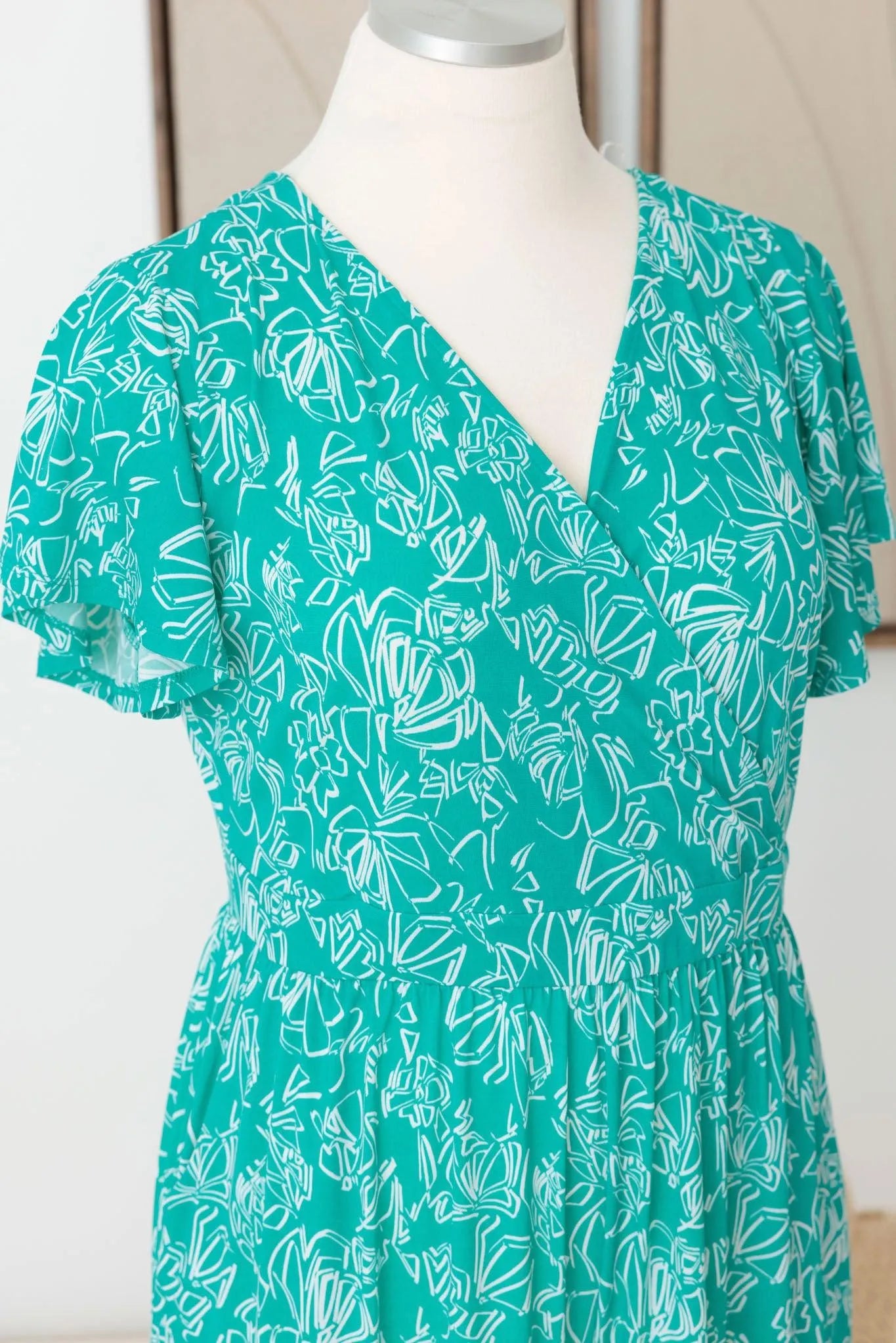 Plus Size Warp Surplice Abstract Wide Leg Jumpsuit - Tasha Apparel Wholesale