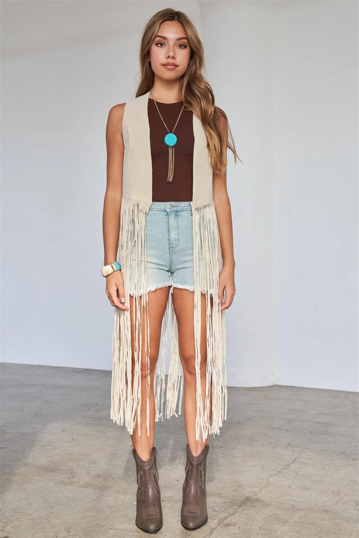 Cream Sleeveless Suede Cropped Boho Vest With Long Fringe Detail - Tasha Apparel Wholesale