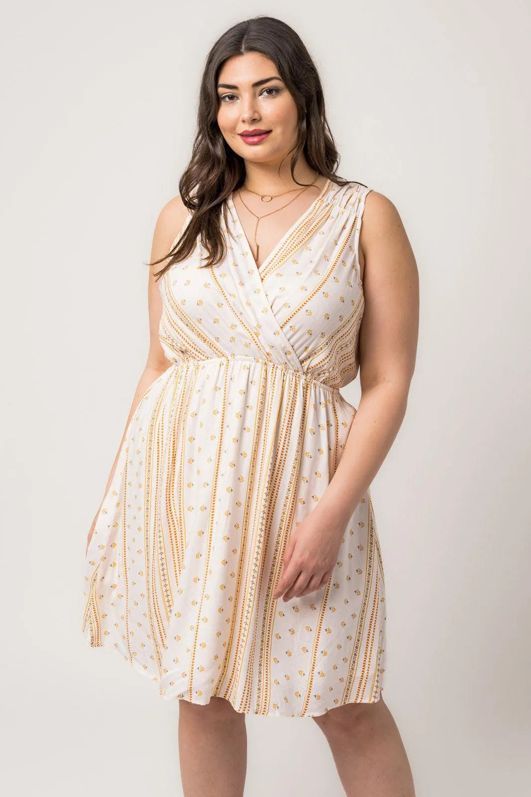 Plus Size Sleeveless Surplice Back Tie Floral Mini Dress - Tasha Apparel Wholesale