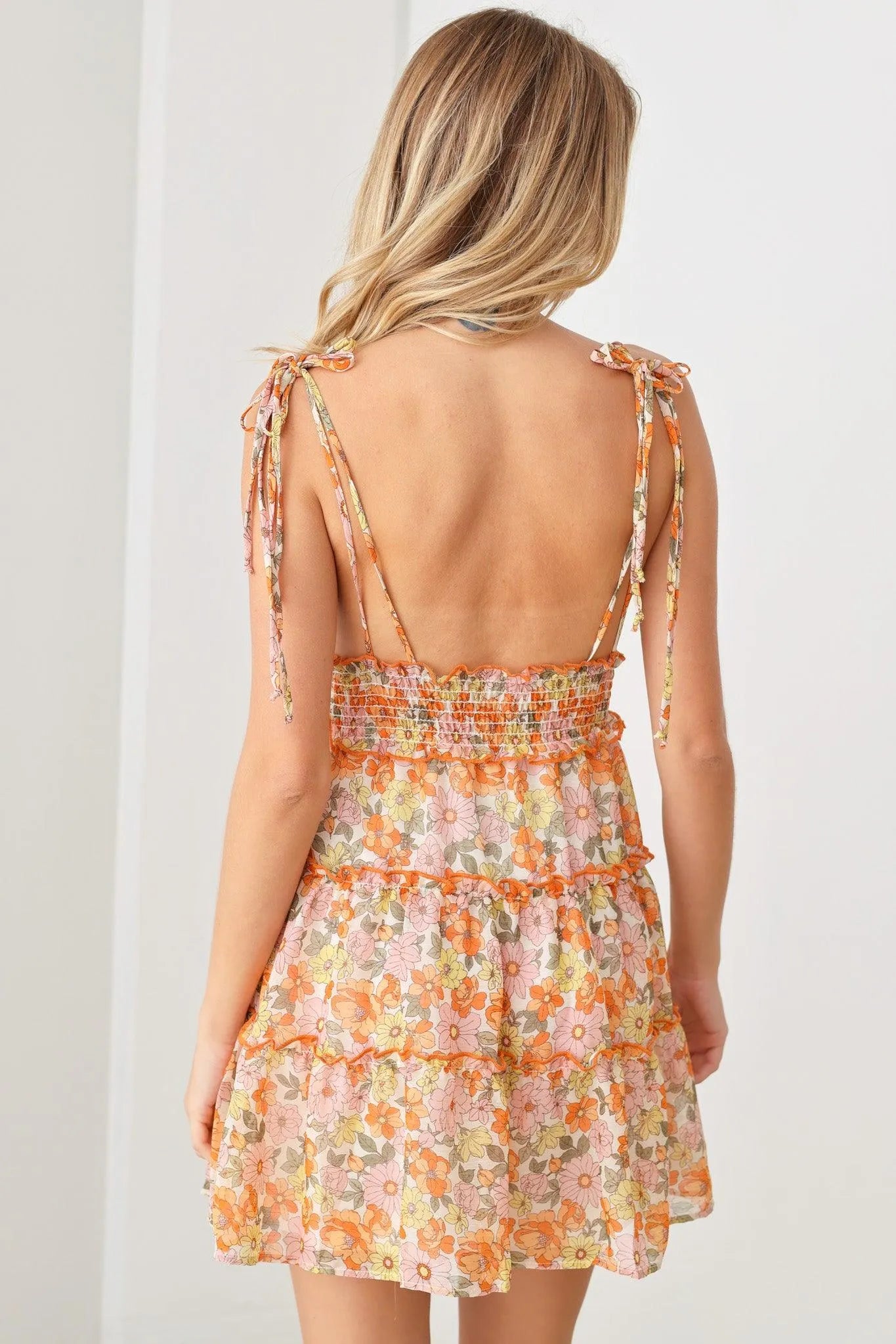 Retro Boho Floral Print Adjustable Tie Straps Smocked Backless Ruffle Mini Dress - Tasha Apparel Wholesale