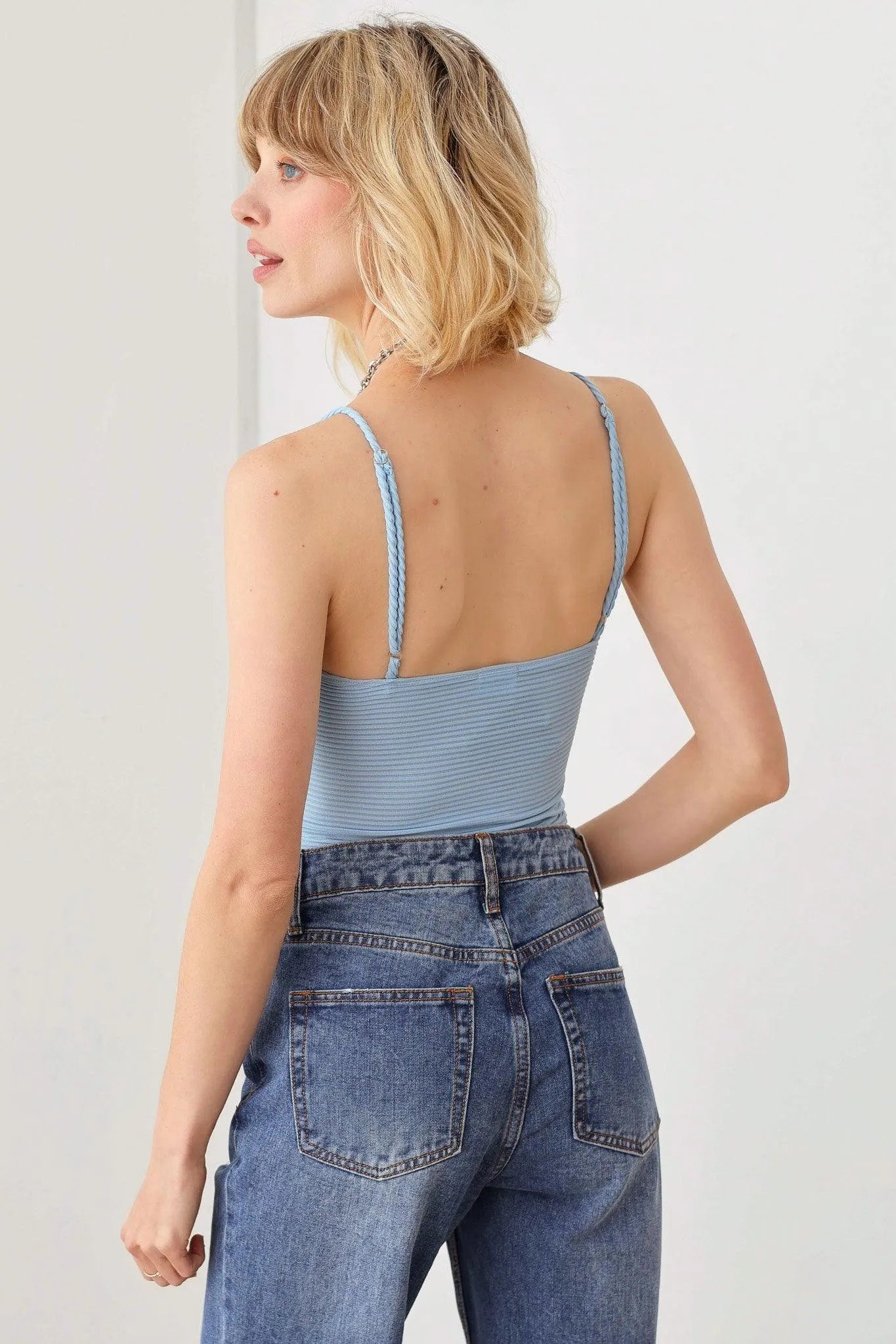 Ribbed Plunging Neckline Ruched Bust Bodysuit - Tasha Apparel Wholesale