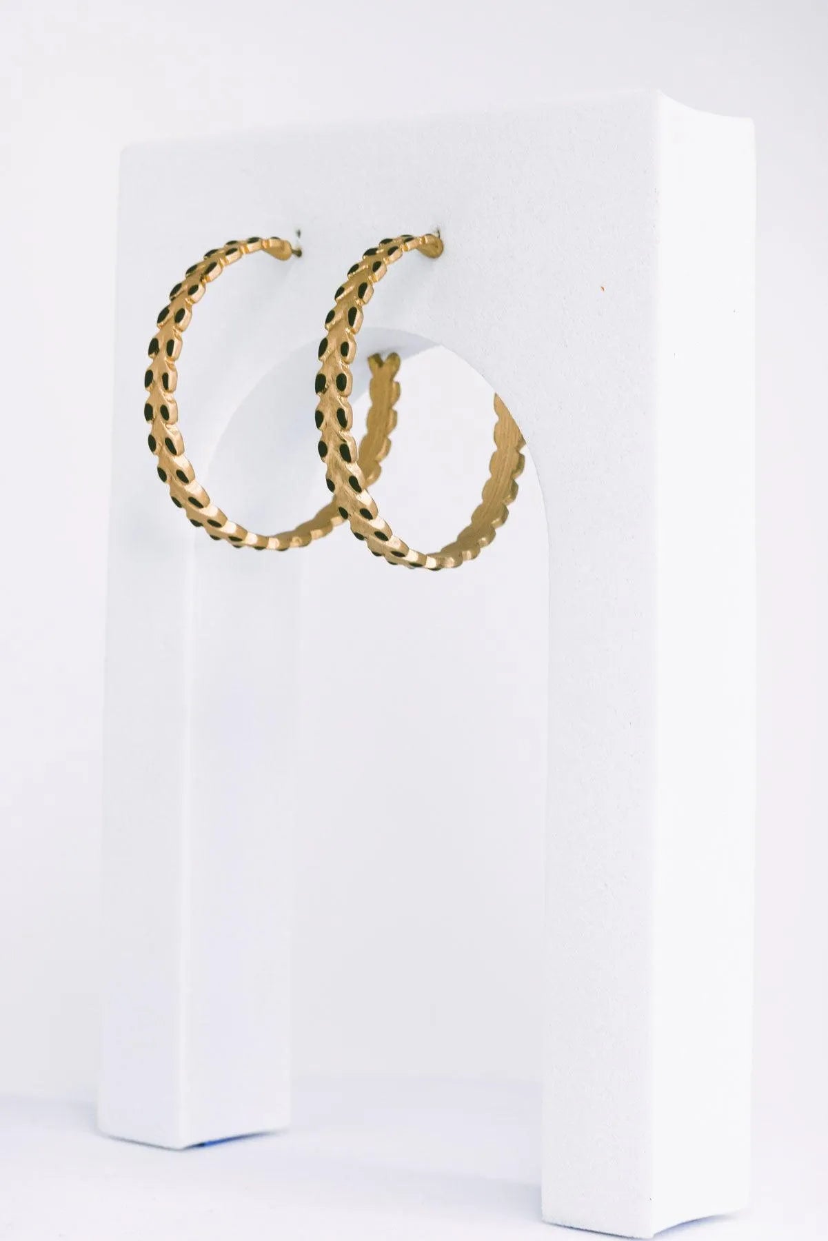 Coated Leaf Accent Metallic Chevron Hoop Earrings - Tasha Apparel Wholesale