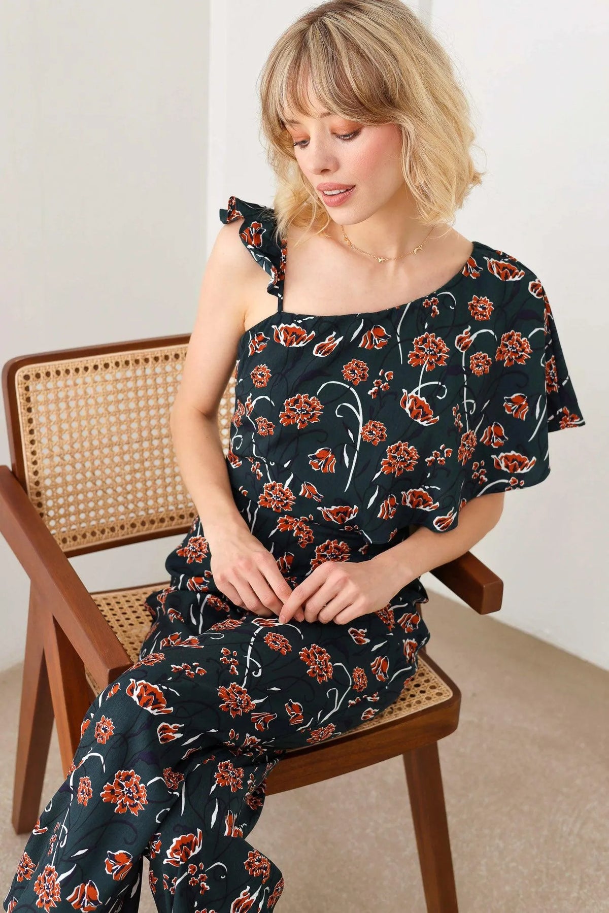Floral Short Ruffle Sleeve Ruffle Strap Wide Leg Side Zipper Jumpsuit - Tasha Apparel Wholesale