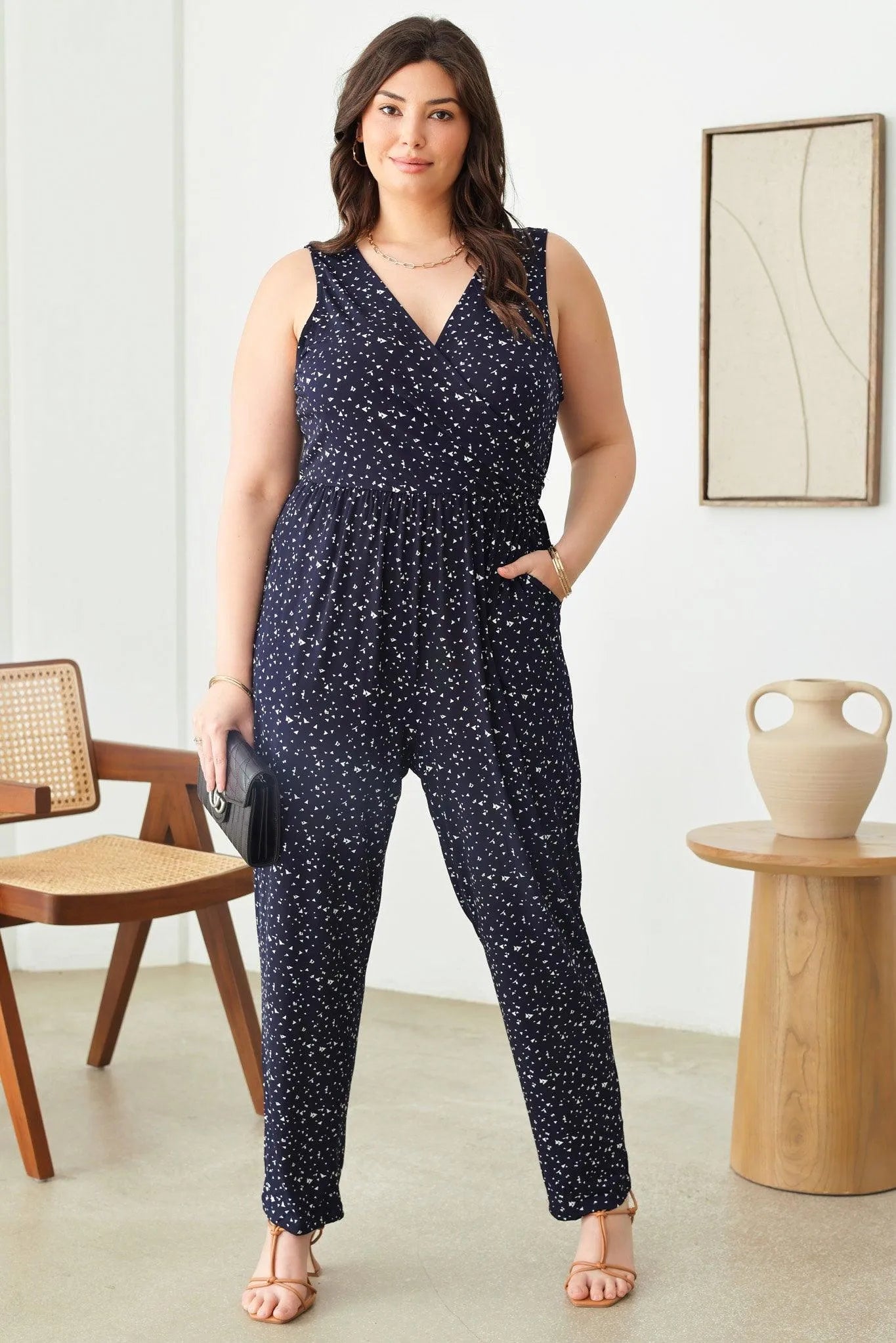 Plus Size Abstract Print Sleeveless Warp Bust Elastic Waist Jumpsuit - Tasha Apparel Wholesale