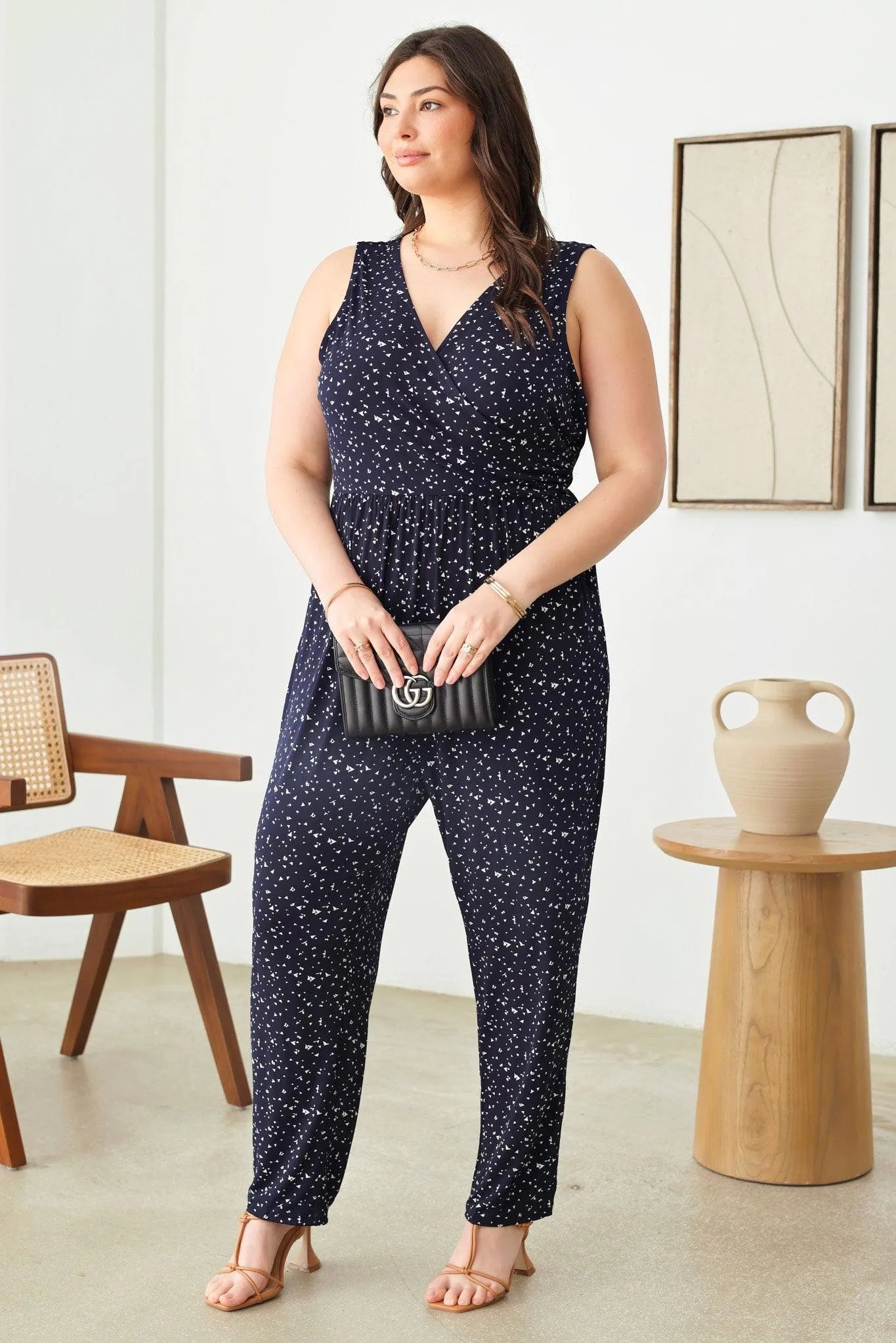 Plus Size Abstract Print Sleeveless Warp Bust Elastic Waist Jumpsuit - Tasha Apparel Wholesale