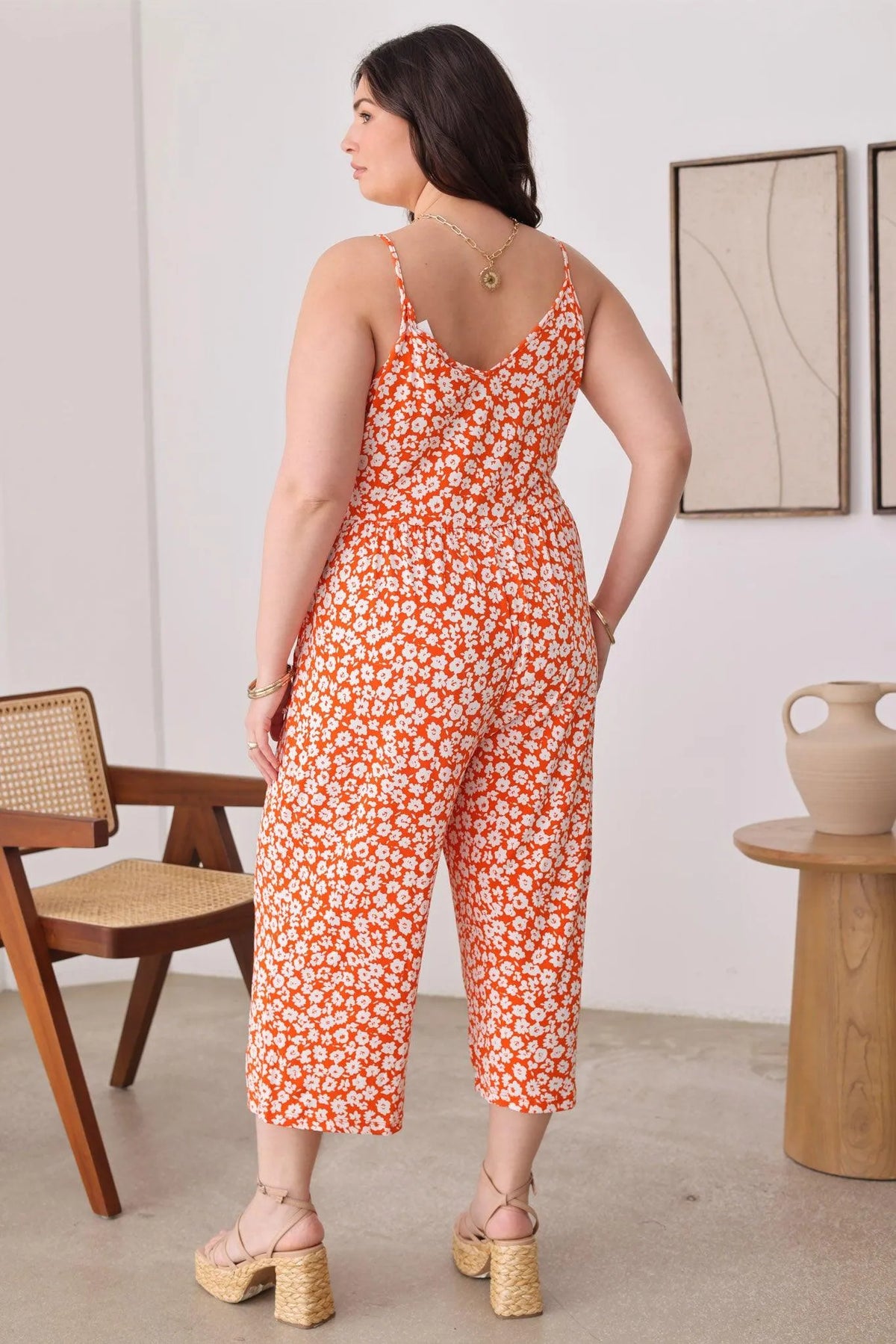 Plus Size Warp Floral Print Wide Capri Leg Side Tie Jumpsuit - Tasha Apparel Wholesale