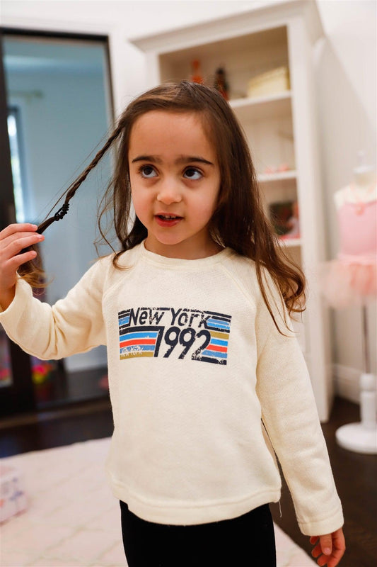 Toddler Little Girls Ivory "New York" Print Long Sleeve Top - Tasha Apparel Wholesale