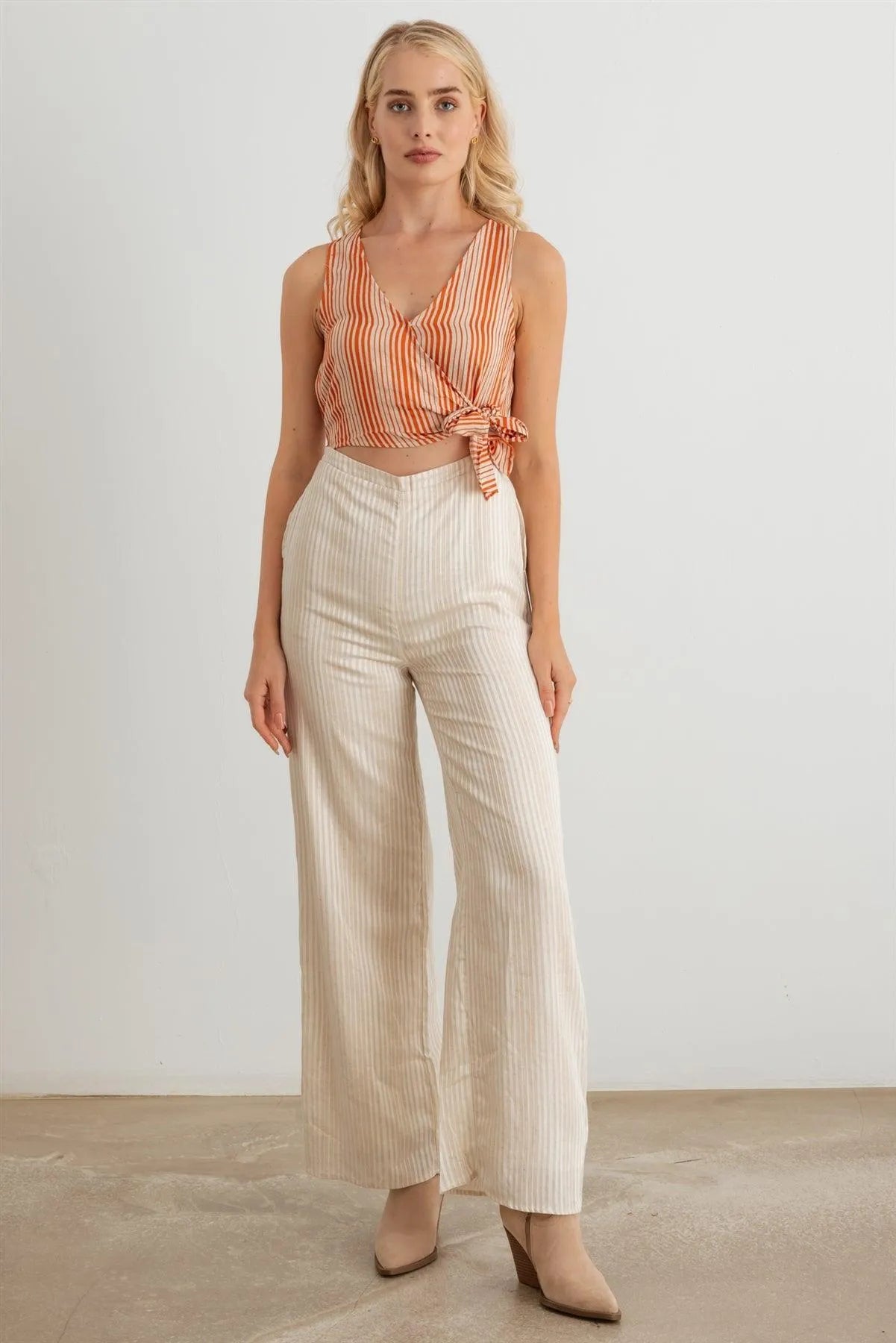 Striped Wrap Tie Neck Sleeveless Cut-Out Front Two Pocket Jumpsuit - Tasha Apparel Wholesale
