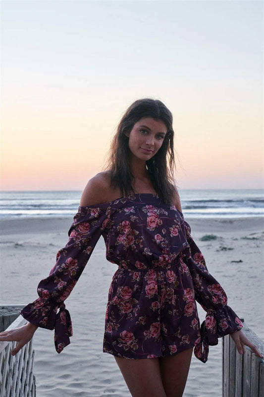 Byzantine Purple Satin Floral Print Off-The-Shoulder Self-Tie Long Sleeve Detail Romper - Tasha Apparel Wholesale