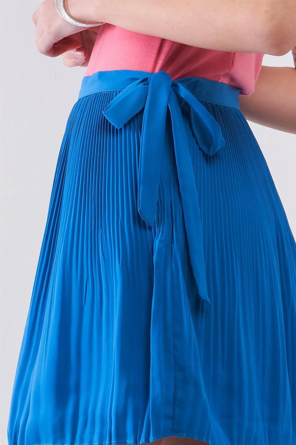 Sapphire Blue Pleated Side Self-Tie Bow Detail High Waist Flare Mini Skirt /1-2-2-1 - Tasha Apparel Wholesale
