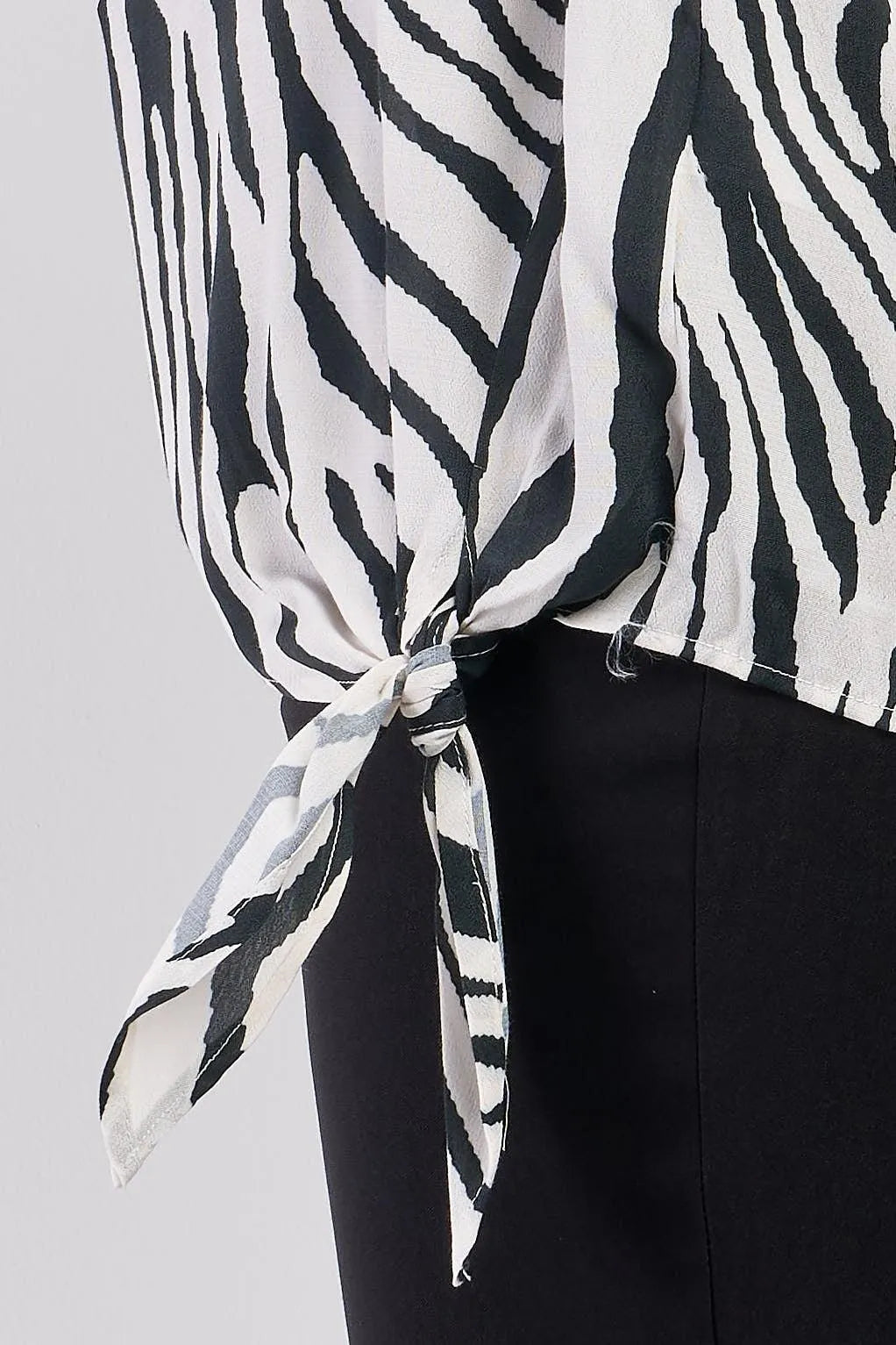 Junior Plus Black & White Zebra Print Sleeveless Self-Tie Detail Relaxed Fit Crew Neck Top /2-2-1 - Tasha Apparel Wholesale